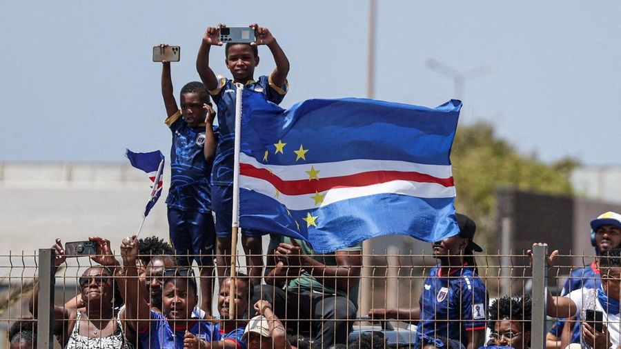 Soccer Football - FIFA World Cup 2026 - Cape Verde arrive home in Praia - Praia, Cape Verde - July 5, 2026 Cape Verde fans assemble with their national flags to welcome the team after they arrive from the United States REUTERS/Sodiq Adelakun
