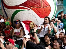 Soccer Football - FIFA World Cup 2026 - Mexico v South Africa -  Fans gather in Mexico City - Zocalo, Mexico City, Mexico - June 11, 2026 - A giant FIFA World Cup 2026 ball behind Mexico fans reacting as they watch the match REUTERS/Marian Carrasquer