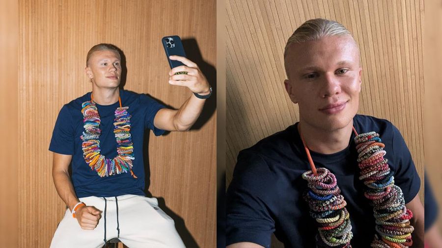Pemain sepak bola Norwegia Erling Haaland berpose dengan ikat rambut KKNEKKI di lehernya dalam gambar promosi yang diunggah pada 5 Juni. (Instagram/kknekki)
