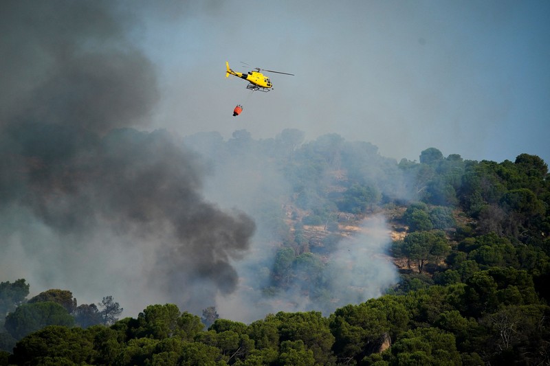 kebakaran hutan di San Martin de Valdeiglesias, Avila, Spanyol, Minggu (26/7/2026). (REUTERS/Ana Beltran)