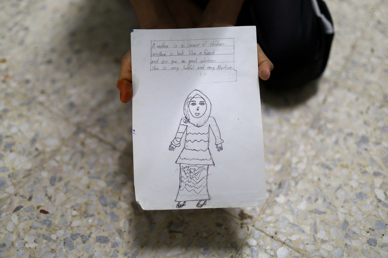 Para siswa di sebuah sekolah untuk pengungsi berpartisipasi dalam kegiatan pembelajaran di tengah lonjakan ujaran kebencian daring yang menargetkan komunitas Rohingya, di Kuala Lumpur, Malaysia, 13 Juli 2026. (REUTERS/Hasnoor Hussain)