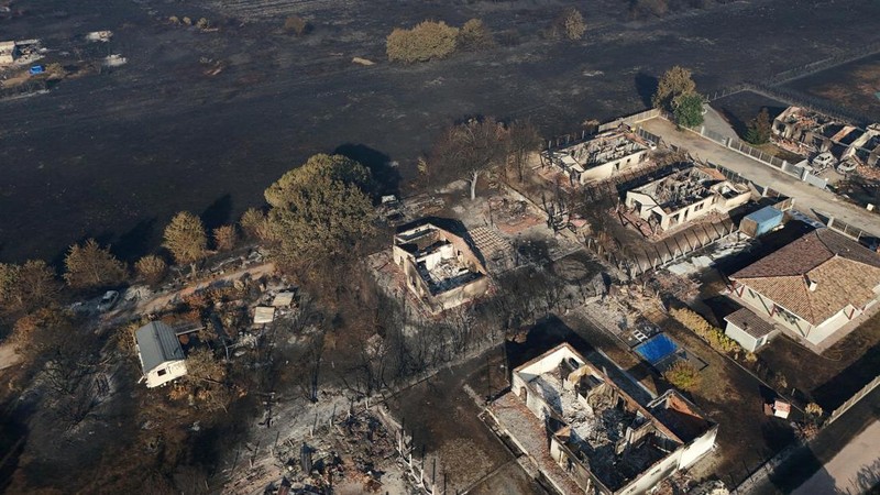 A drone view shows burnt buildings in an area affected by a wildfire in Le Porge, Gironde, amid drought conditions following a heatwave and water shortages across much of France, July 28, 2026. REUTERS/Yves Herman

     TPX IMAGES OF THE DAY