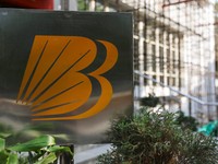 FILE PHOTO: Logo of Bank of Baroda is seen on a stand outside their branch office in New Delhi, India, June 20, 2023. REUTERS/Anushree Fadnavis/File Photo
