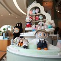 Guests wait next to a shelf of Labubu toys at Pop Mart's first international bakery during their media day at Resorts World Sentosa in Singapore July 29, 2026. REUTERS/Edgar Su