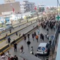 People run near the border-crossing complex in Beni Ansar, Morocco, in this still image obtained from social media video released July 30, 2026.   SOCIAL MEDIA/via REUTERS  THIS IMAGE HAS BEEN SUPPLIED BY A THIRD PARTY. NO RESALES. NO ARCHIVES. NEWS