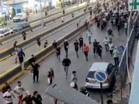 People run near the border-crossing complex in Beni Ansar, Morocco, in this still image obtained from social media video released July 30, 2026.   SOCIAL MEDIA/via REUTERS  THIS IMAGE HAS BEEN SUPPLIED BY A THIRD PARTY. NO RESALES. NO ARCHIVES. NEWS