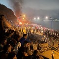 Migrants gather around a torched vehicle while waiting for a chance to cross to the Spanish enclave of Ceuta, on the Moroccan side of the border in Fnideq, Morocco, July 31, 2026. Picture taken with a mobile phone.   REUTERS/Ahmed El Jechtimi     TPX