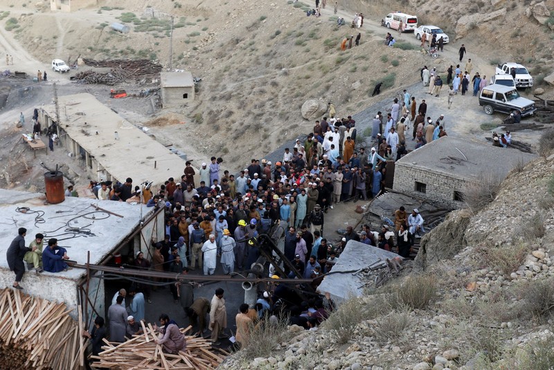 People gather after an explosion buried parts of a coal mining complex on the outskirts of Quetta, Pakistan, July 30, 2026. REUTERS/Naseer Ahmed