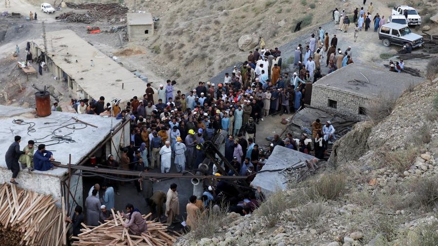 People gather after an explosion buried parts of a coal mining complex on the outskirts of Quetta, Pakistan, July 30, 2026. REUTERS/Naseer Ahmed