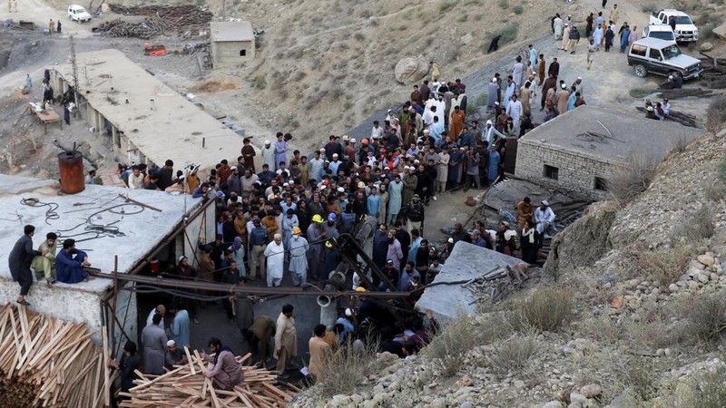 People gather after an explosion buried parts of a coal mining complex on the outskirts of Quetta, Pakistan, July 30, 2026. REUTERS/Naseer Ahmed