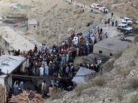People gather after an explosion buried parts of a coal mining complex on the outskirts of Quetta, Pakistan, July 30, 2026. REUTERS/Naseer Ahmed