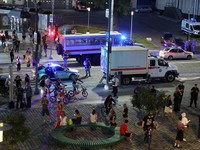 Law enforcement officers and emergency services personnel near the site of an explosion at a restaurant in central Moscow, Russia August 1, 2026. REUTERS/Anastasia Barashkova