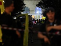 Law enforcement officers and emergency services personnel near the site of an explosion at a restaurant in central Moscow, Russia August 1, 2026. REUTERS/Anastasia Barashkova