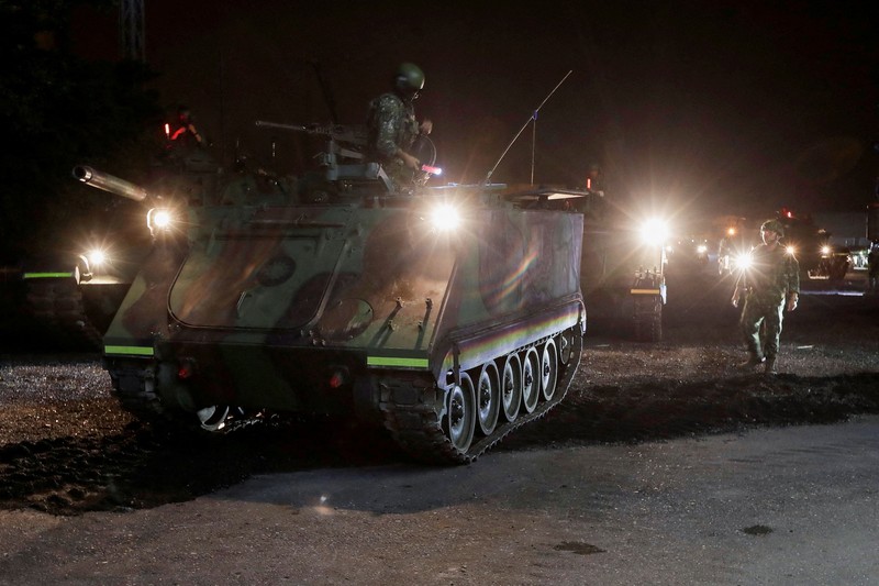 Para prajurit berpartisipasi dalam misi pertahanan untuk sebuah pelabuhan vital selama latihan militer tahunan Han Kuang di Yilan, Taiwan timur laut, pada hari Senin, 10 Agustus 2026. (Chiang Ying-ying/Pool via REUTERS)