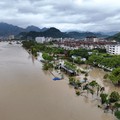 Tampilan dari drone memperlihatkan sebuah desa yang terendam banjir akibat hujan deras yang dibawa oleh Topan Dolphin di Kota Dajing, Yueqing, Provinsi Zhejiang, Tiongkok, pada 10 Agustus 2026. (cnsphoto via REUTERS)