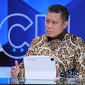 Chief Economist PT Bank Negara Indonesia (Persero) Tbk, Leo Putra Rinaldy menyampaikan pemaparan dalam Power Lunch di Jakarta, Kamis (13/8/2026). (CNBC Indonesia/Tri Susilo)