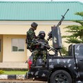 Armed military men keep watch from a military truck during a public destruction exercise at the Muhammadu Buhari Cantonment in Abuja, Nigeria, July 30, 2026. REUTERS/ Marvellous Durowaiye