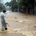 A police officer controls a road covered with floodwaters following the torrential rain in Geoje, South Korea, August 17, 2026.    Yonhap via REUTERS   THIS IMAGE HAS BEEN SUPPLIED BY A THIRD PARTY. NO RESALES. NO ARCHIVES. SOUTH KOREA OUT. NO COMMER