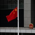 Chinese and Hong Kong flags fly at half-mast at the Central Government Offices on the day of the cremation of former Chinese Premier Zhu Rongji, in Hong Kong, China, August 18, 2026. REUTERS/Tyrone Siu