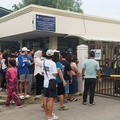 People stand outside Ateneo de Zamboanga University after a shooting that killed two people, in Zamboanga, southern Philippines, August 18, 2026. REUTERS/Nonoy Lacson     TPX IMAGES OF THE DAY