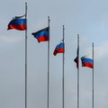 Flags fly outside a burnt-out hypermarket following an overnight attack, what Russian-installed authorities called a Ukrainian drone strike, in the course of the Russia-Ukraine conflict in Makiivka (Makeyevka) in the Donetsk region, a Russian control