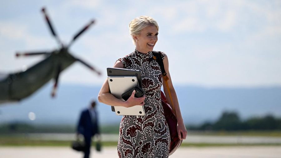 U.S. President Donald Trump's executive assistant Natalie Harp walks as Trump (not pictured) travels following a Camp David meeting of the cabinet, at Hagerstown Regional Airport in Hagerstown, Maryland, U.S., July 31, 2026. REUTERS/Daniel Heuer