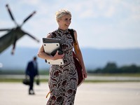 U.S. President Donald Trump's executive assistant Natalie Harp walks as Trump (not pictured) travels following a Camp David meeting of the cabinet, at Hagerstown Regional Airport in Hagerstown, Maryland, U.S., July 31, 2026. REUTERS/Daniel Heuer