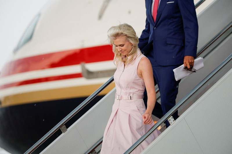 U.S. President Trump walks by his Executive assistant Natalie Harp as they attend a dignified transfer of the remains of U.S. Army service members, Army 1st Lt Tyler James Feehan, Sgt. Angel S. Rampersad, Pvt. Isabella Gonzales, killed during an attack on Muwaffaq Salti Air Base in Jordan, and Sgt. Michael Emmanuel Swinton, killed in action during a controlled detonation of a downed one-way unmanned aerial system at Erbil Air Base in Iraq, at Dover Air Force Base in Dover, Delaware, U.S., July 22, 2026. REUTERS/Evan Vucci