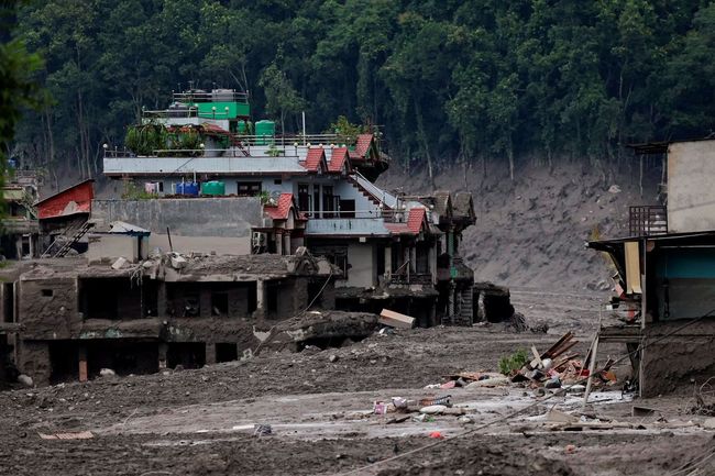 Rumah-rumah yang rusak akibat banjir bandang di Trishuli, Distrik Nuwakot, Nepal, pada 26 Agustus 2026. Rumah-rumah yang rusak akibat banjir bandang di Trishuli, Distrik Nuwakot, Nepal, pada 26 Agustus 2026.