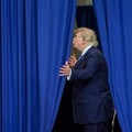 U.S. President Donald Trump gestures, as he leaves after delivering remarks at David S. Mack Center for Training and Intelligence in Garden City, New York, U.S., August 14, 2026. REUTERS/Ken Cedeno     TPX IMAGES OF THE DAY