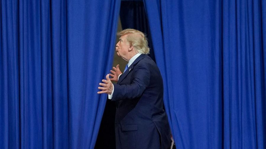 U.S. President Donald Trump gestures, as he leaves after delivering remarks at David S. Mack Center for Training and Intelligence in Garden City, New York, U.S., August 14, 2026. REUTERS/Ken Cedeno     TPX IMAGES OF THE DAY