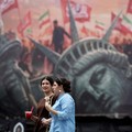 FILE PHOTO: People walk past an anti-U.S. billboard on a street in Tehran, Iran, August 3, 2026. Majid Asgaripour/WANA (West Asia News Agency) via REUTERS    ATTENTION EDITORS - THIS PICTURE WAS PROVIDED BY A THIRD PARTY. ISRAEL OUT. NO COMMERCIAL OR
