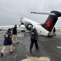 FILE PHOTO: National Transportation Safety Board (NTSB) investigators inspect the wreckage of an Air Canada Express jet that collided with a fire truck at LaGuardia Airport in Queens, New York, U.S., March 23, 2026. NTSB/Handout via REUTERS   THIS IM