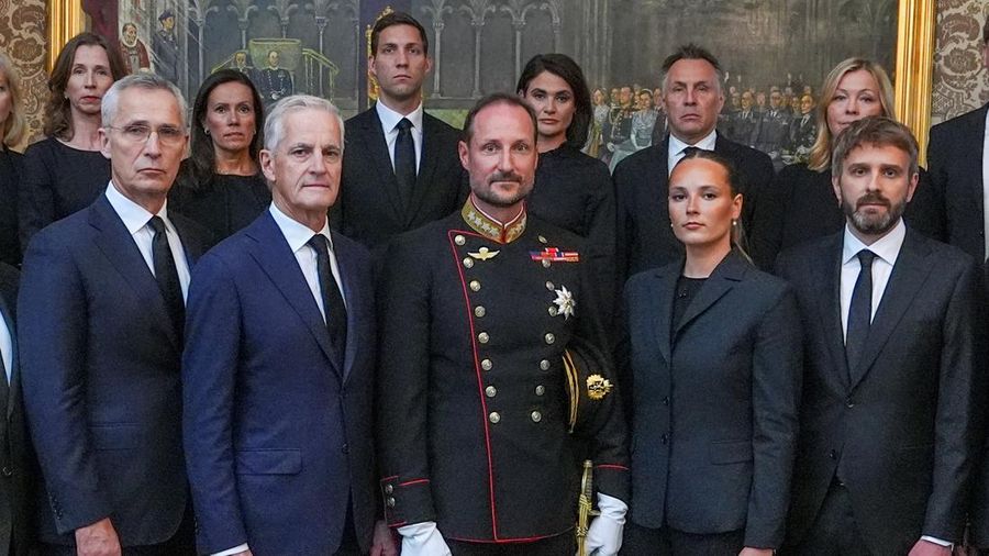 Norway's King Haakon and Crown Princess Ingrid Alexandra pose with Prime Minister Jonas Gahr Stoere and cabinet ministers during an extraordinary cabinet meeting at the Royal Palace, following the death of King Harald, in Oslo, Norway, August 28, 202