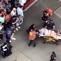 Petugas tanggap darurat membawa sejumlah orang ke ambulans setelah sedikitnya dua pejalan kaki ditikam di kawasan Times Square, New York, Senin (31/8/2026). (Tangkapan Layar Video Reuters/)