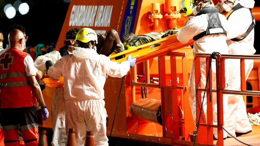 Rescuers help a migrant disembarking from a Spanish coast guard vessel at the port of Arguineguin, on the island of Gran Canaria, Spain, September 3, 2026. REUTERS/Borja Suarez