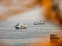 FILE PHOTO: Vessels near the Strait of Hormuz, as seen from Musandam, Oman, August 31, 2026. REUTERS/Stringer     TPX IMAGES OF THE DAY/File Photo