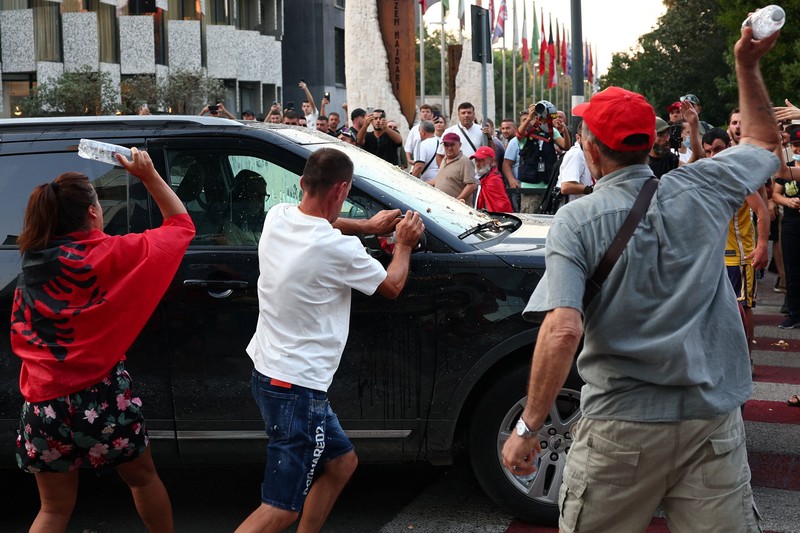 Police cover themselves with their shields during a demonstration against the government, following months of protests against a planned luxury resort backed by a company linked to Jared Kushner, the son-in-law of U.S. President Donald Trump, on an environmentally sensitive part of the Adriatic coast, in Tirana, Albania, September 8, 2026. REUTERS/Florion Goga     TPX IMAGES OF THE DAY