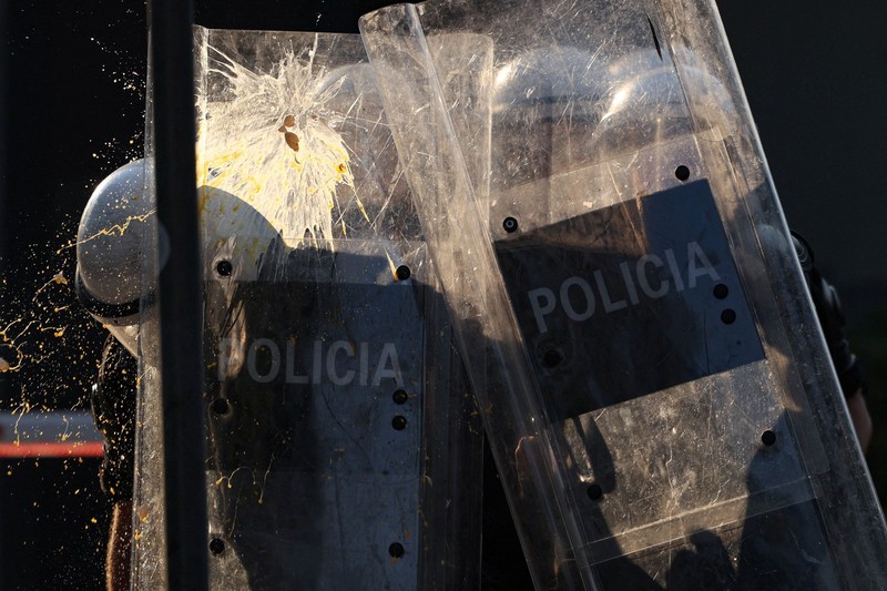 Police cover themselves with their shields during a demonstration against the government, following months of protests against a planned luxury resort backed by a company linked to Jared Kushner, the son-in-law of U.S. President Donald Trump, on an environmentally sensitive part of the Adriatic coast, in Tirana, Albania, September 8, 2026. REUTERS/Florion Goga     TPX IMAGES OF THE DAY