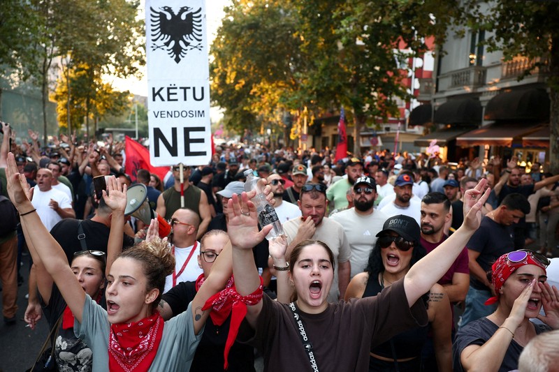 Police cover themselves with their shields during a demonstration against the government, following months of protests against a planned luxury resort backed by a company linked to Jared Kushner, the son-in-law of U.S. President Donald Trump, on an environmentally sensitive part of the Adriatic coast, in Tirana, Albania, September 8, 2026. REUTERS/Florion Goga     TPX IMAGES OF THE DAY