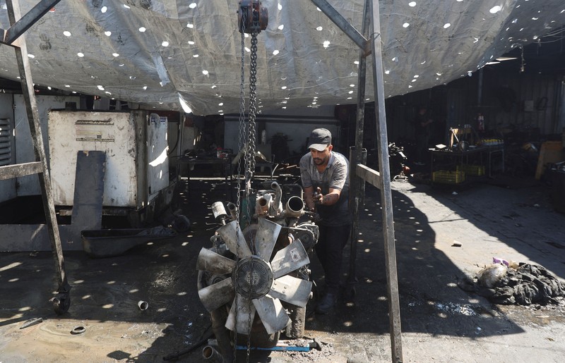 A Palestinian man lights a fire inside a tent amid shortages of electricity and fuel, in Khan Younis, in the southern Gaza Strip, September 5, 2026. REUTERS/Ramadan Abed