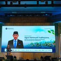 Menteri Koordinator Bidang Infrastruktur dan Pembangunan Kewilayahan (Menko IPK) Agus Harimurti Yudhoyono saat memberikan paparan dalam Forum Koordinasi Penanganan Permukiman Kumuh Terpadu di Auditorium BRIN, Jakarta, Senin (14/9/2026). (CNBC Indones