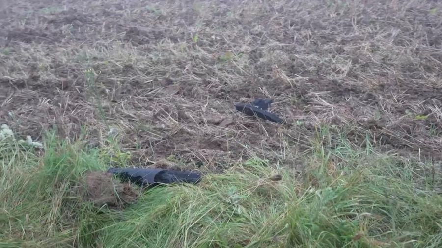 Debris of what, according to the Lithuanian national crisis management centre, was a drone shot down by a NATO fighter jet, lies on the ground near Pratkunai village, Lithuania, September 15, 2026, in this screengrab from a handout video. Lithuanian