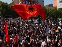 Supporters of former Kosovo President Hashim Thaci gather on the day Thaci and other former Kosovo Liberation Army (KLA) members hear the judgment in their war crimes trial at the Kosovo Specialist Chambers in The Hague, in Pristina, Kosovo September