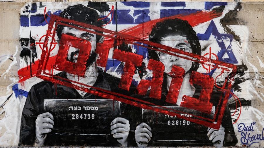 Graffiti depicting Yuval Abraham and Rachel Szor, the directors of the documentary film NAZA, and the word "traitors" in Hebrew, on a wall in Ashdod, southern Israel, September 15, 2026. NAZA was awarded the Special Jury Prize at the Venice Film Fest