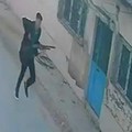 This handout photograph taken and released on September 22,2026 by Turkish news agency DHA (Demiroren News Agency) shows a CCTV image of a gunman running near a school in Turgutlu, an area west of the resort city of Izmir. A gunman opened fire outsid
