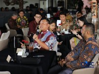 Deputy Director Commercial PT Surveyor Indonesia, M. Chairudin menyampaikan paparan dalam acara Coffe Morning di Parle, Senayan, Jakarta, Kamis (24/9/2026). (CNBC Indonesia/Tri Susilo)