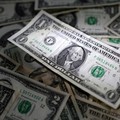 FILE PHOTO: U.S. dollar banknotes are seen in this illustration taken March 10, 2023. REUTERS/Dado Ruvic/Illustration/File Photo
