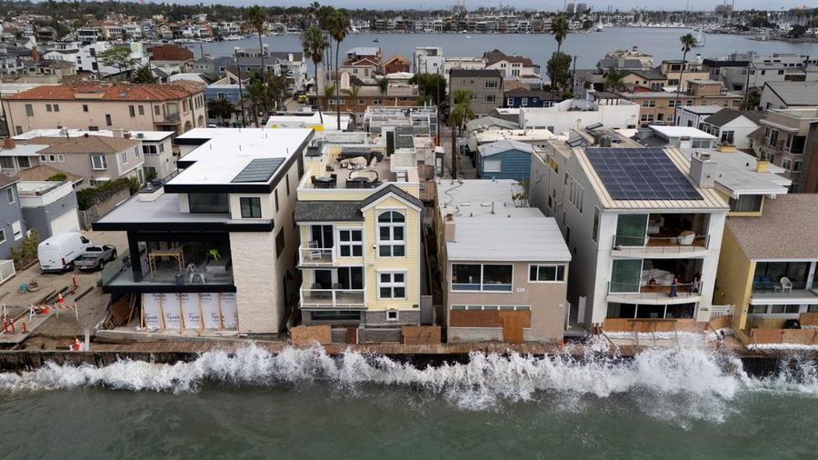 A drone view shows waves crashing into a boardwalk in Long Beach, California, US, September 16, 2026. REUTERS/Daniel Cole