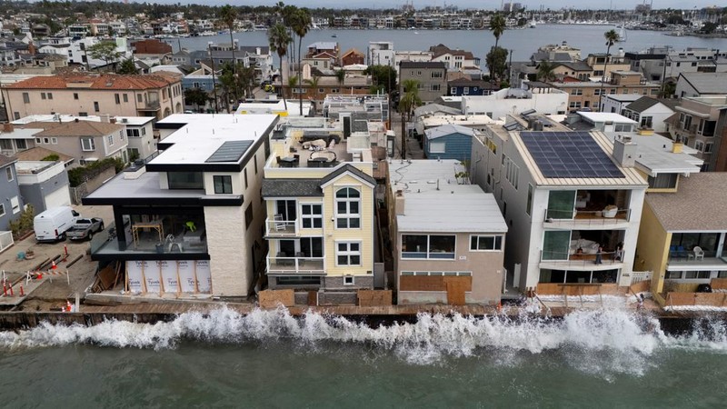 A drone view shows waves crashing into a boardwalk in Long Beach, California, US, September 16, 2026. REUTERS/Daniel Cole